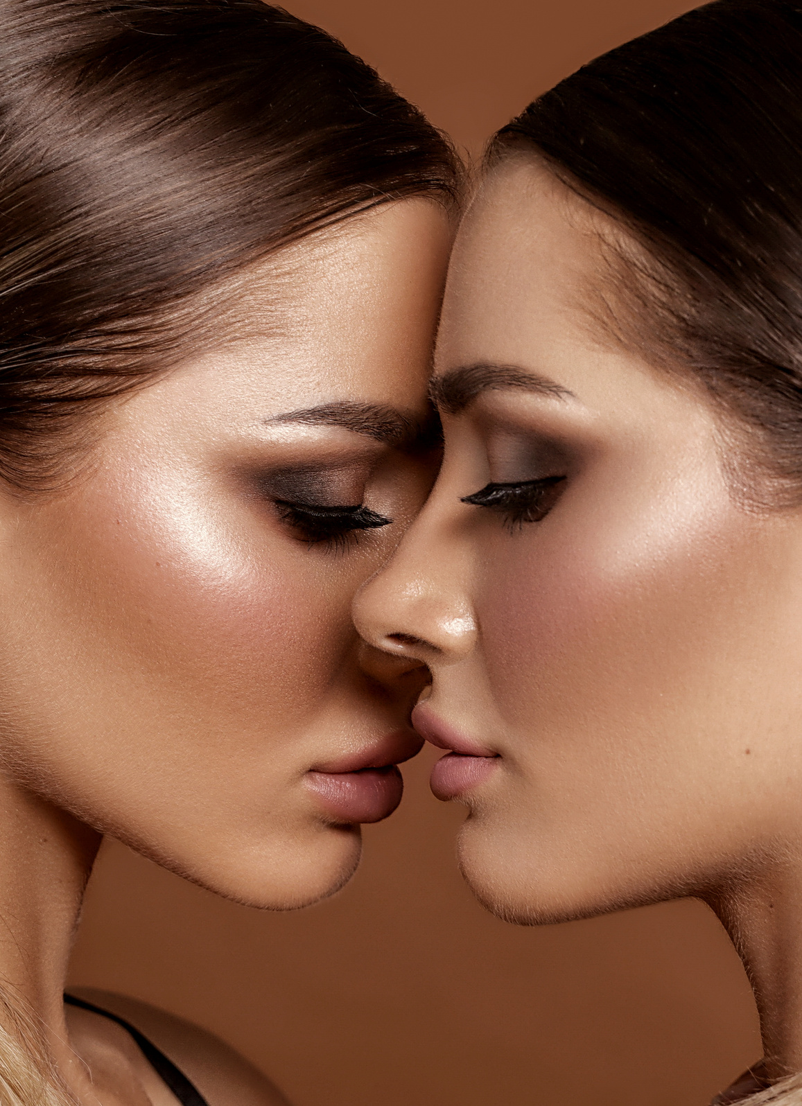 Two attractive twins women in glamour makeup